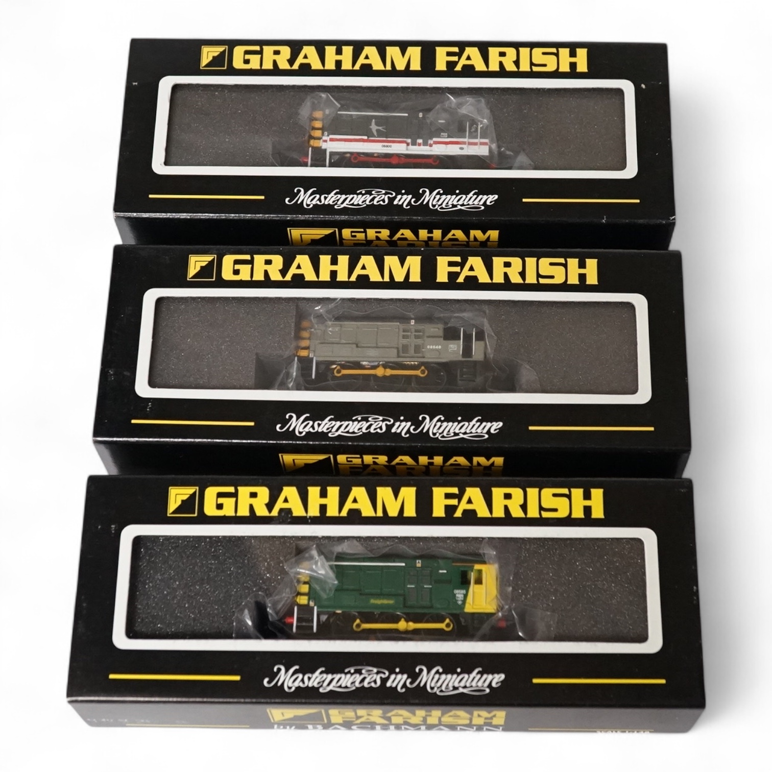 Three boxed Graham Farish N gauge railway Class 08 diesel locomotives; 08585 (371006), 08800 (371005) and 08648 (371007). Condition - good.